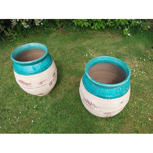 30A - Pair of good quality glazed terracotta urns. {69 cm H x 51 cm Dia.}.