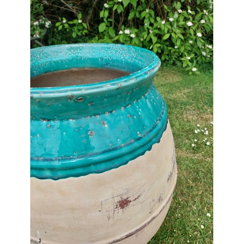 30A - Pair of good quality glazed terracotta urns. {69 cm H x 51 cm Dia.}.