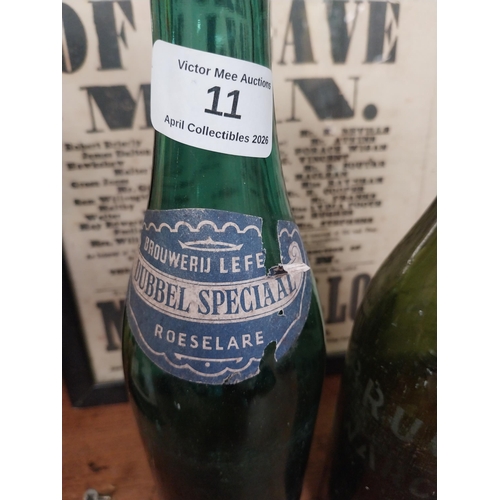 11 - Two Brouweru Lefrere Bubbel Speciaal Roeselare glass advertising bottles. {31 cm H x 8 cm Dia.}.