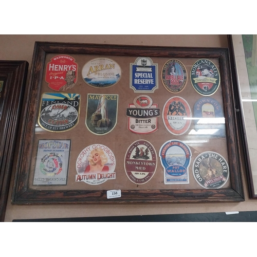 158 - Framed montage of beer mats. {49 cm H x 64 cm W}.