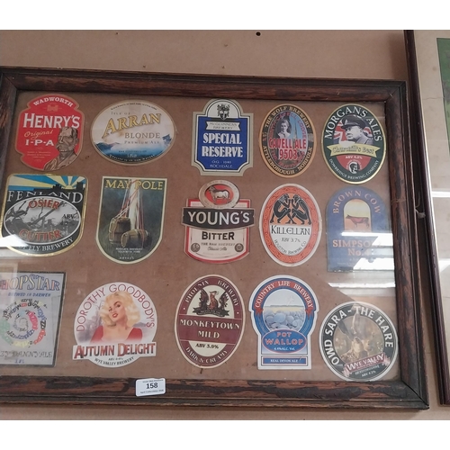 158 - Framed montage of beer mats. {49 cm H x 64 cm W}.