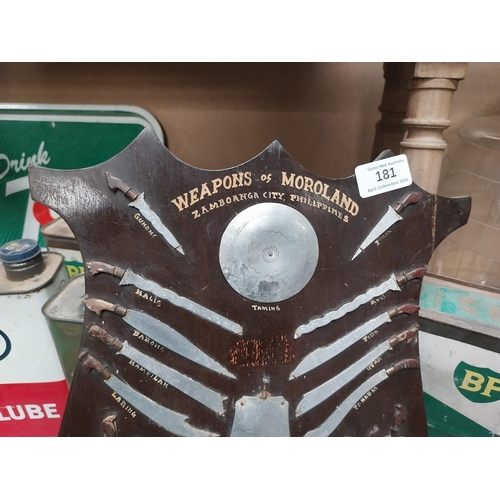 181 - Weapons of Moroland Samboanga City Philippines advertising shield. {37 cm H x 30 cm W}.