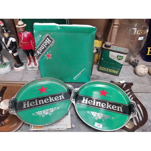 182 - Two Heineken Lager drinks tray. {32 cm H x 37 cm W}.