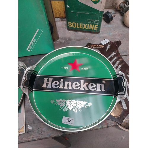 182 - Two Heineken Lager drinks tray. {32 cm H x 37 cm W}.