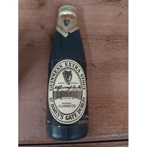 27 - Guinness plastic model of pint glass {14 cm H x 8 cm Dia.}  and Guinness bottle. {18 cm H x 5 cm W}.