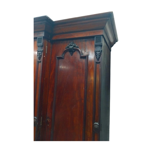 46 - 19th C. mahogany breakfront three door wardrobe with central mirrored panel above three drawers. {23... 