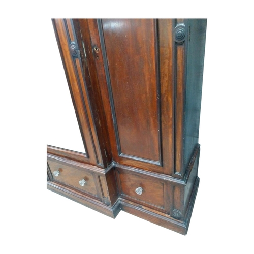 46 - 19th C. mahogany breakfront three door wardrobe with central mirrored panel above three drawers. {23... 