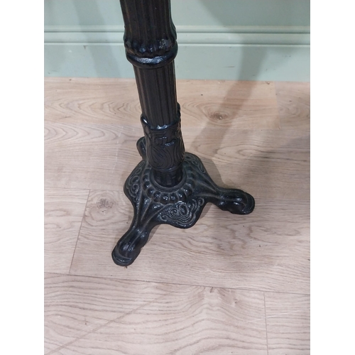 34 - Cast iron marble topped wine table. {70 cm H x 35 cm Dia.}.