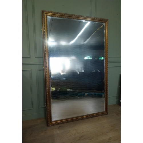 25 - Large gilt wall mirror in the Victorian style. {216 cm H x 140 cm W}.