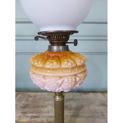 10 - Early 20th C. brass oil lamp with coloured glass bowl and opaline glass shade. {74 cm H x 18 cm Dia.... 