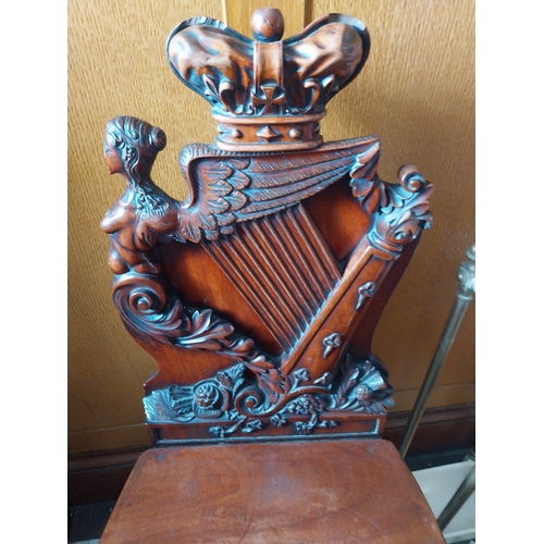 20 - Good quality 19th. C. carved mahogany hall chair with back decorated with The Hibernian Harp & Crown... 