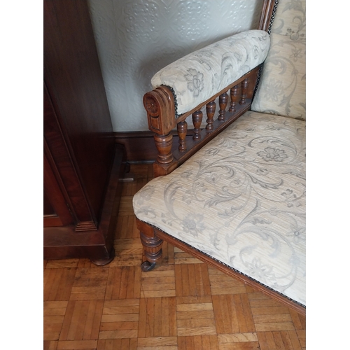 55 - Edwardian carved oak upholstered armchair raised on turned legs. { 110cm H X 78cm W X 71cm D }.