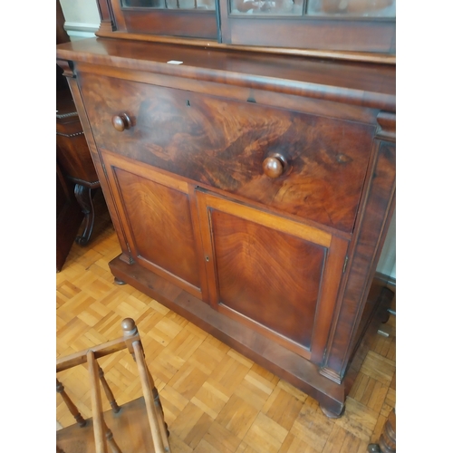 56 - Early 19th. C. mahogany bureau bookcase, the Gothic style glazed doors above a fall front and two bl... 