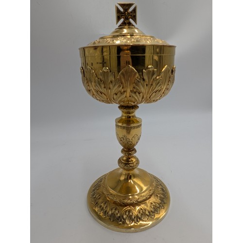 Unique Irish 22ct gold Ciborium. The cup & lid stamped 22ct gold  Wt: 350 grms. & base Stamped 18ct gold  238 grms,  decorated with  foliage, the lid surmounted with a Cross. Hallmarked in Dublin. 1882. Maker's name John Donegan. Wt: 588.3grms. {24cm H X 11.5cm Dia }. - NOT ON SITE FOR VIEWING