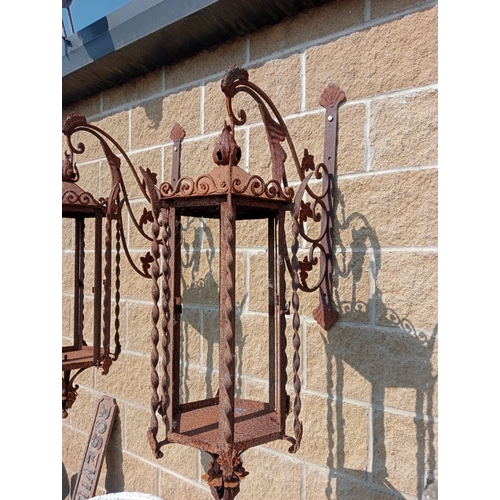 11 - Pair of wrought iron wall lights with brackets. {H 120 cm x W 30 cm x D 60 cm}. NOT ON SITE FOR VIEW... 