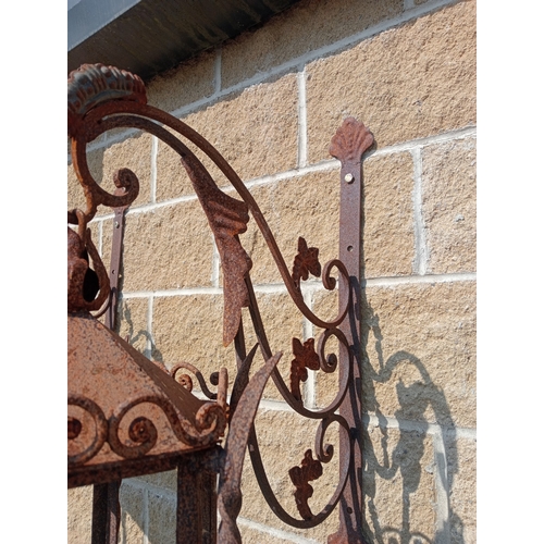 11 - Pair of wrought iron wall lights with brackets. {H 120 cm x W 30 cm x D 60 cm}. NOT ON SITE FOR VIEW... 