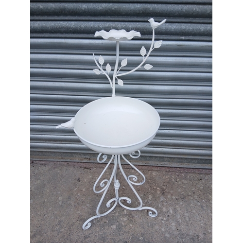 35 - Wrought iron bird bath decorated with birds on three scrolled legs.  {H 90cm x Dia 37cm}. NOT ON SIT... 