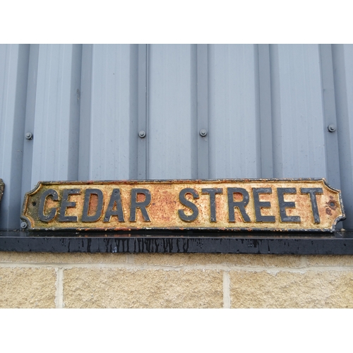 41 - Cedar Street cast iron street sign. {H 18cm x W 102cm}. NOT ON SITE FOR VIEWING