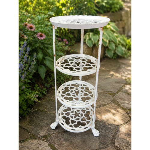31 - Cast iron four tier plant stand with claw feet.  {H 70cm x Dia 35cm}. NOT ON SITE FOR VIEWING