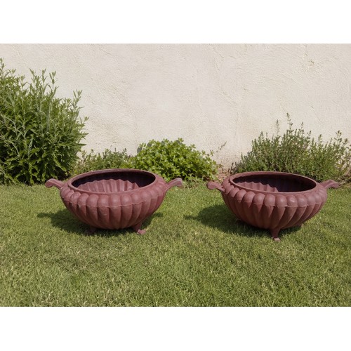39 - Pair of cast iron fluted planters.  {H 17cm x W 42cm x D 32cm}. NOT ON SITE FOR VIEWING