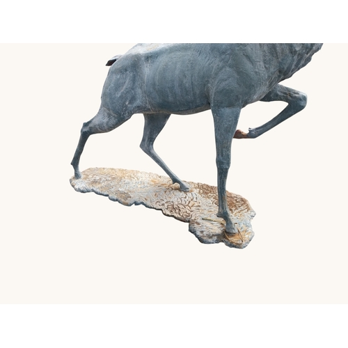 44 - Lead effect cast iron model of bellowing Stag on plinth. {174 cm H x 124 cm W x 90 cm D}.