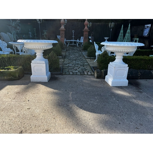 9 - Pair of cast iron urns in the Georgian manner {95cm H x 901cm Dia.} (Plants not included)