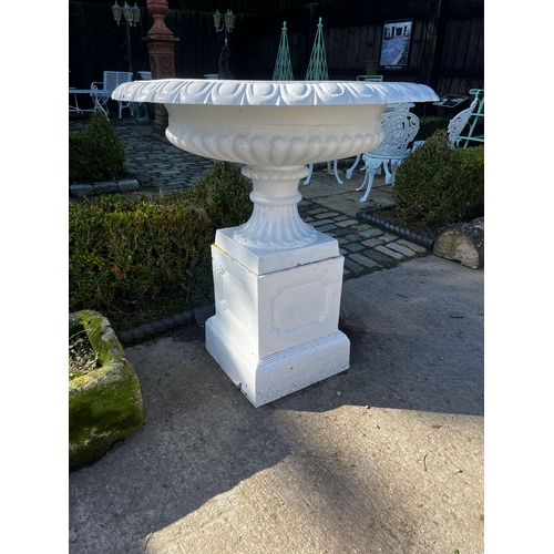 9 - Pair of cast iron urns in the Georgian manner {95cm H x 901cm Dia.} (Plants not included)