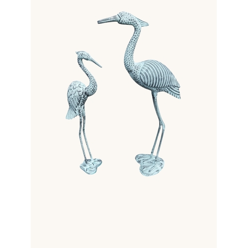 7 - Two bronzed metal cranes. {96 cm H x  52 cm W x 27 cm D} and {80 cm H x 32 cm W x 18 cm D}.