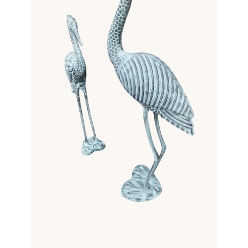 7 - Two bronzed metal cranes. {96 cm H x  52 cm W x 27 cm D} and {80 cm H x 32 cm W x 18 cm D}.