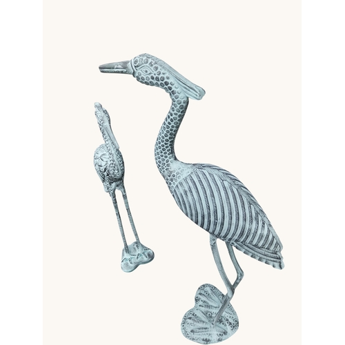 7 - Two bronzed metal cranes. {96 cm H x  52 cm W x 27 cm D} and {80 cm H x 32 cm W x 18 cm D}.