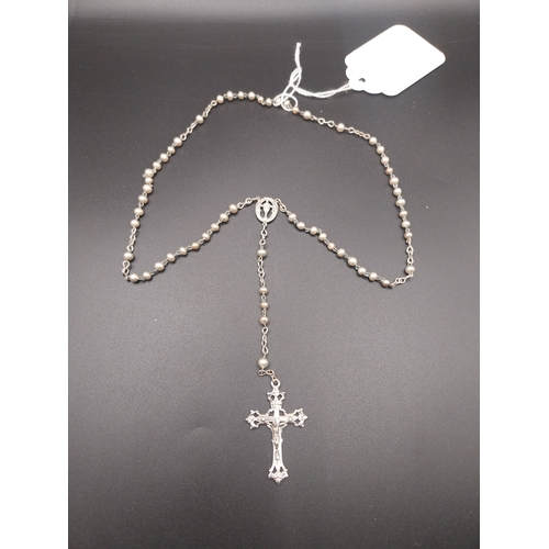12 - Faux pearl rosary beads.