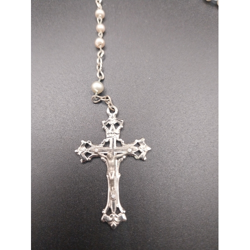 12 - Faux pearl rosary beads.