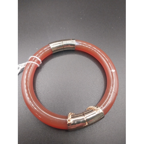 17 - Chinese Agate hinged bangle with gold coloured hardware.