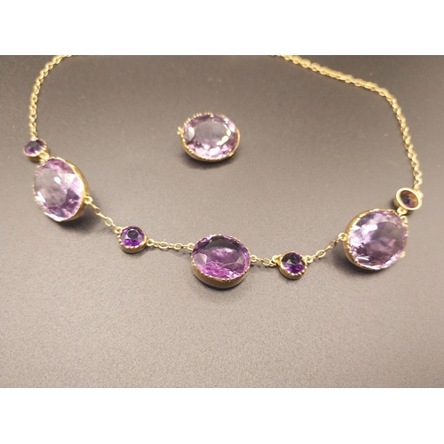 21 - 18 ct gold  and graduated amethyst necklace with spare stone. Wt: 17.7 grms.