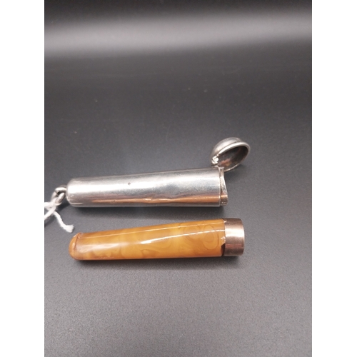 25 - Cigarette holder with amber insert in silver case. Hallmarked in London 1900. Wt: 20 grms.
