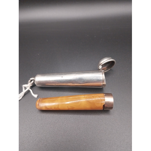 25 - Cigarette holder with amber insert in silver case. Hallmarked in London 1900. Wt: 20 grms.
