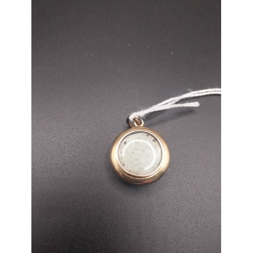 28 - Decorative locket with small medal inside.