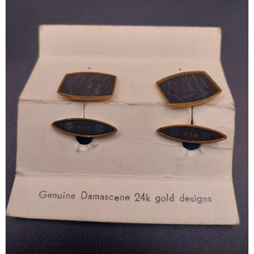 34 - Damascene 24 ct gold cuff links with Asian design.