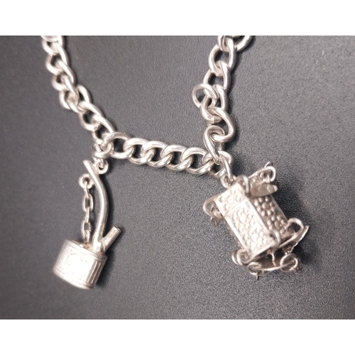 36 - Silver charm bracelet. Wt: 12.6 grms.