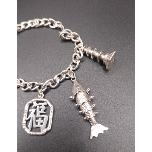 36 - Silver charm bracelet. Wt: 12.6 grms.