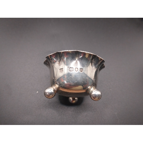 42 - Four silver salt pots with spoons. Hallmarked in London. Wt: 72.7 grms in total.