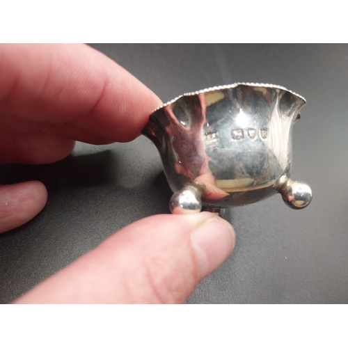 42 - Four silver salt pots with spoons. Hallmarked in London. Wt: 72.7 grms in total.