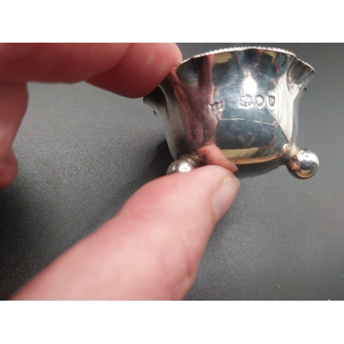 42 - Four silver salt pots with spoons. Hallmarked in London. Wt: 72.7 grms in total.