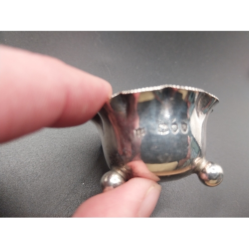 42 - Four silver salt pots with spoons. Hallmarked in London. Wt: 72.7 grms in total.