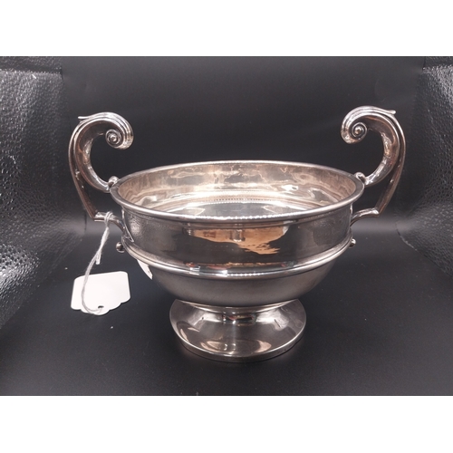 45 - Silver trophy. Hallmarked London. { 12 cm H x 18 cm W }. Wt: 177 grms.