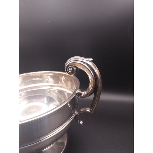 45 - Silver trophy. Hallmarked London. { 12 cm H x 18 cm W }. Wt: 177 grms.