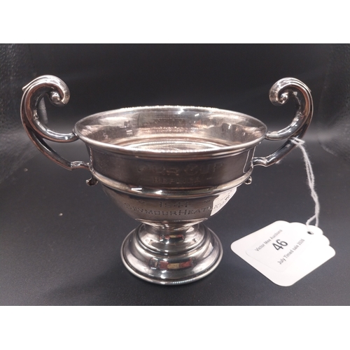 46 - Silver trophy. Hallmarked  London. { 6 cm H x 10cm W}.  Wt: 80 grms.