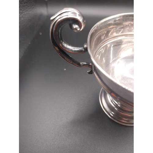 46 - Silver trophy. Hallmarked  London. { 6 cm H x 10cm W}.  Wt: 80 grms.
