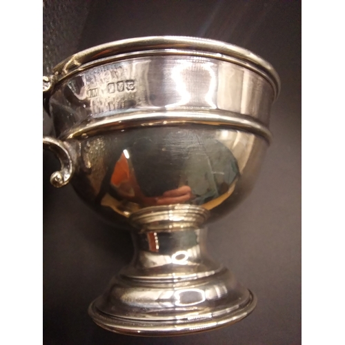 46 - Silver trophy. Hallmarked  London. { 6 cm H x 10cm W}.  Wt: 80 grms.