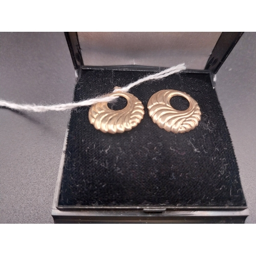 53 - Gold metal earrings.